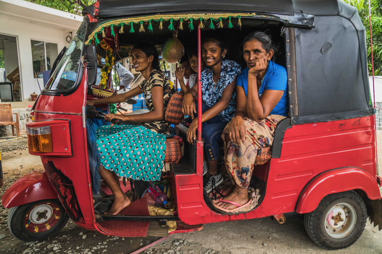 A tuktuk with local lady driving it