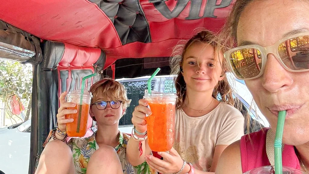 Travelers enjoying refreshing drinks, showing the joy of Cambodian travel