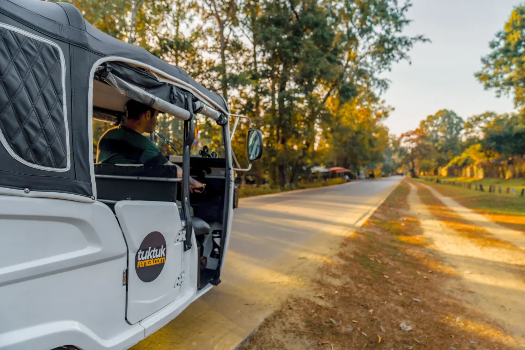 driving a tuktuk-in cambodia side picture