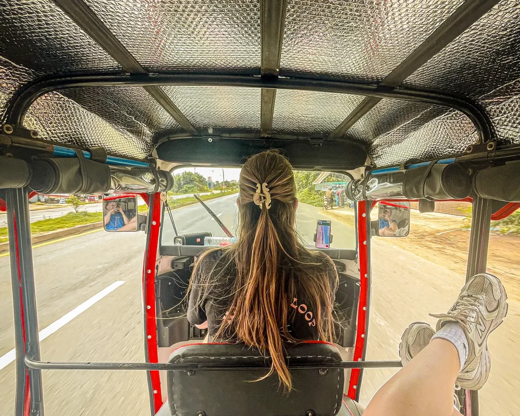 Backseat view of tuk-tuk ride.