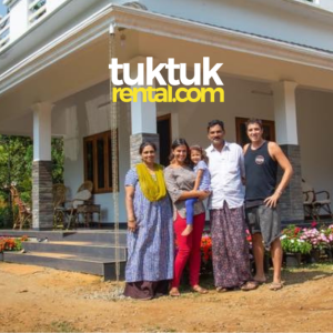 A family picture with a red tuk-tuk parked.