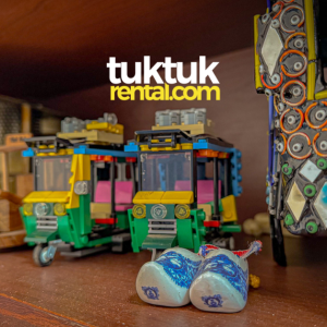 tuk toys background logo