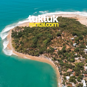 A drone shot of a seaside view with a logo.
