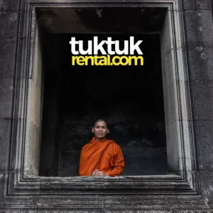 Buddhist monk standing in ancient temple window.